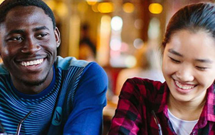 Two students laughing.