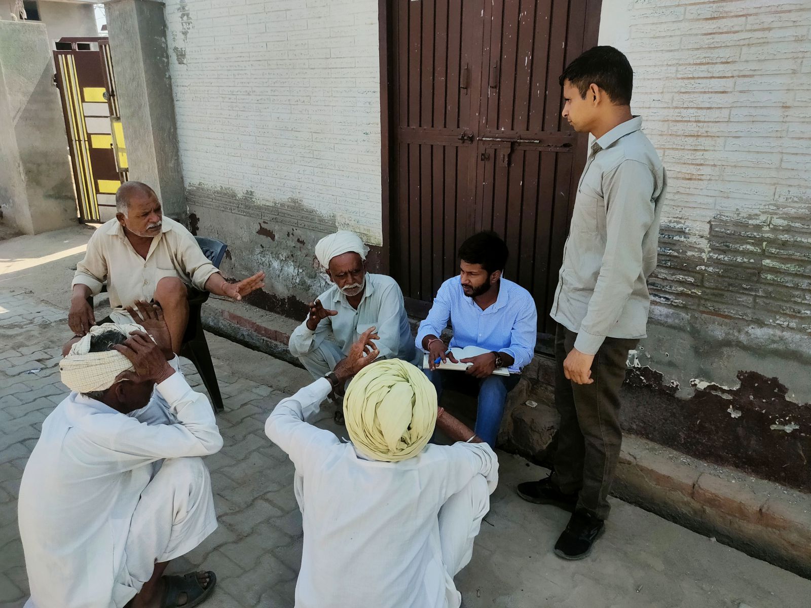 Group of men having a discussion.
