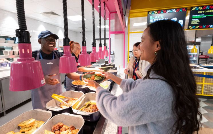 A student is served the Sussex Saver at Eat Central