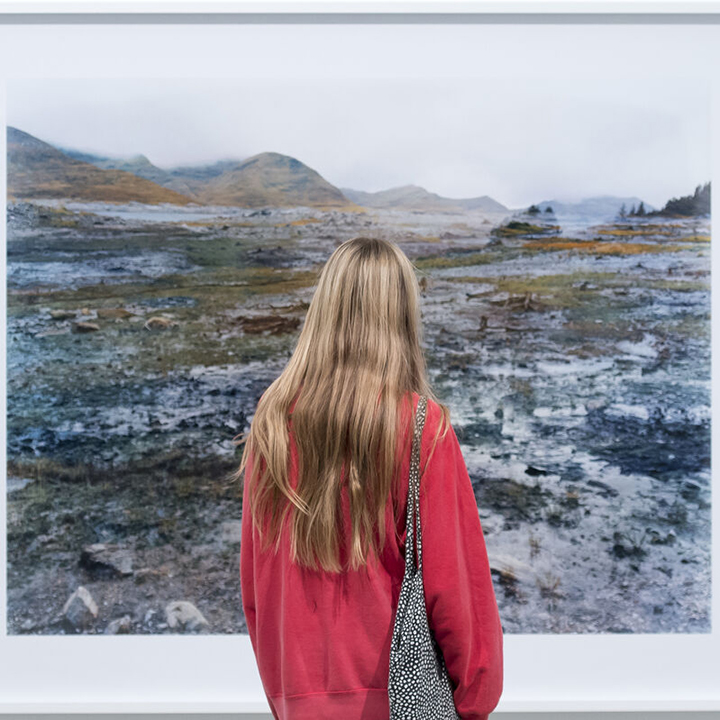 Student looking at art in gallery