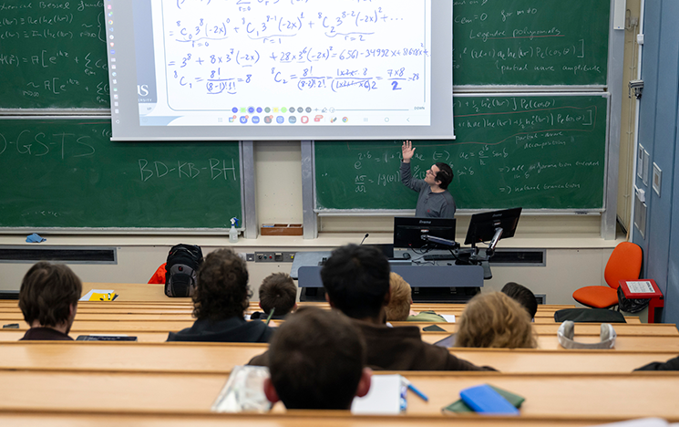 Students listening to a maths lecture.