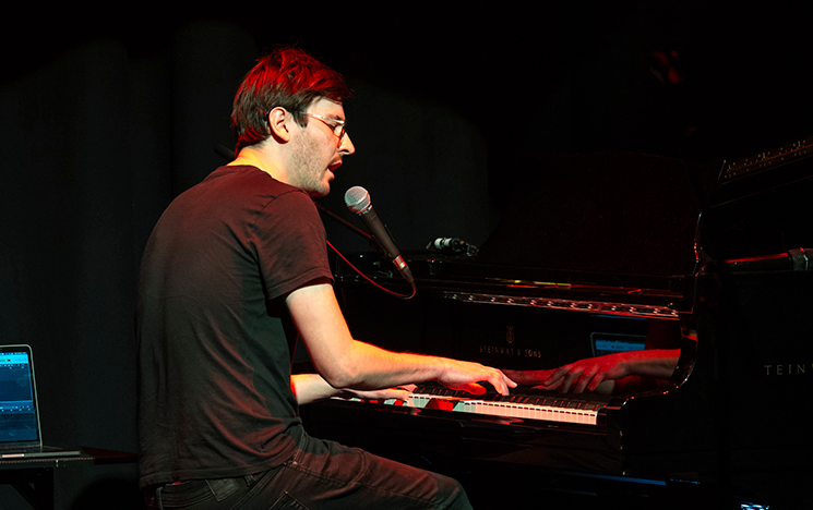 A student performing on a piano