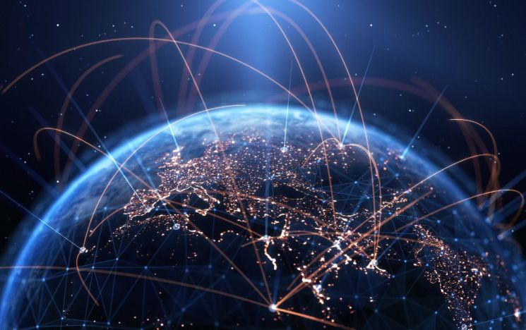 An image of the globe with gold lines denoting connectivity