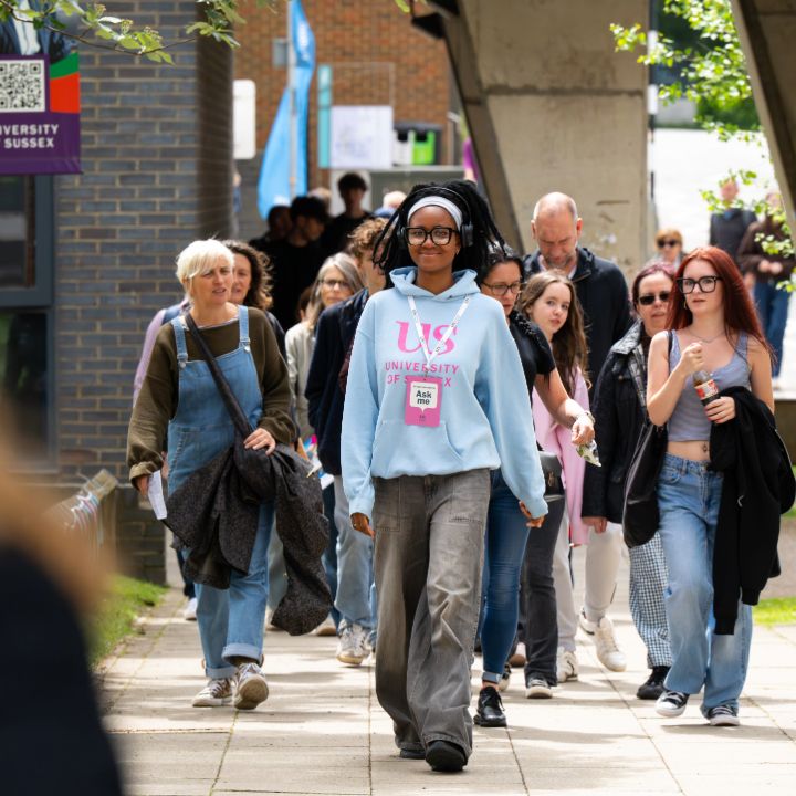 A Student Ambassador guides Open Day attendees through the Sussex campus