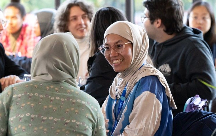 Two students chat at a scholarship reception