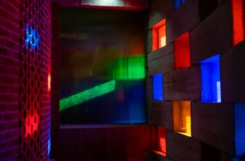 Light coming through the coloured windows of the Meeting House