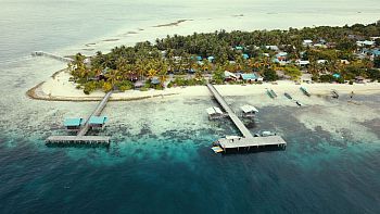 Eagle eye's view of a tropical island surrounded by turquoise waters