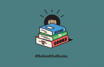 A graphic showing a stack of three books and a person with dark hair peeking out behind them, against a dark teal background. The text reads #BehindtheBooks underneath.