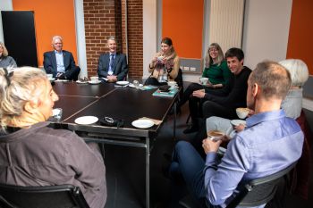 A photo of the Climate Coffees event showing the VC and staff talking