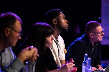 Four judges from Pitch for the Planet 2021, including Adam Tickell, the former Vice-Chancellor, listen as a student pitches their idea off camera.