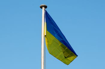 The blue and yellow Ukrainian flag flies above Sussex House on the University of Sussex campus