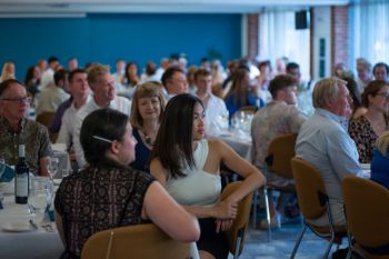 Group shot of guests seated at dinner