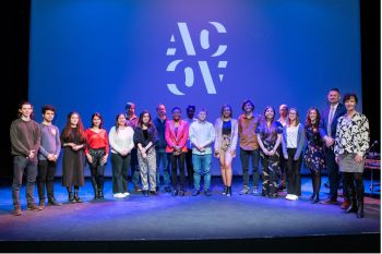 Some of the winners of Pitch for the Planet 2022 stand on stage with the judges