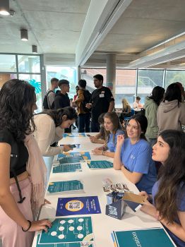 Business School students talking to student ambassadors at the start of term