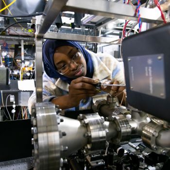 A female student is pictured working on a quantum computer in the University laboratory