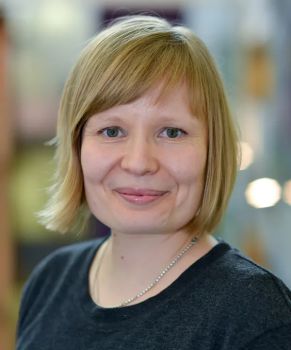 Photo of a headshot of a woman with light blonde hair