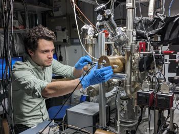 Dr Foni Raphaël Lebrun-Gallagher working on a piece of equipment