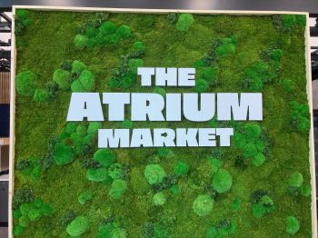 The Atrium Market sign made from petrified moss