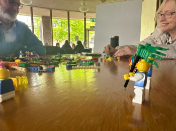 Picture of people using Lego as part of an activity