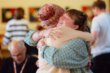 Jenny Mitchell hugs an attendee