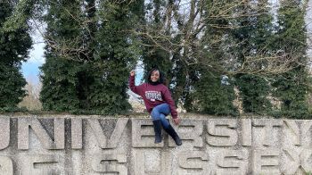 Thokozani Makuyana sat atop the University of Sussex sign