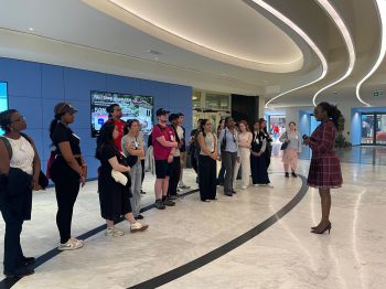 Students standing in foyer at FAO building, Rome