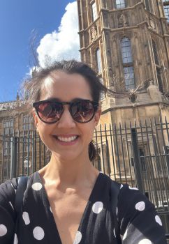 Dr Beatriz Kira outside the Houses of Parliament in London