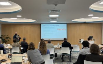 A man makes a presentation in a room