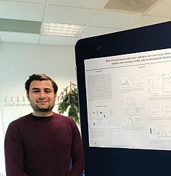 Okan Sevim presenting research poster