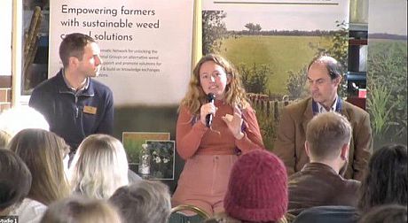 Dr Rachael Durrant speaks to crowd on stage at agroecology conference